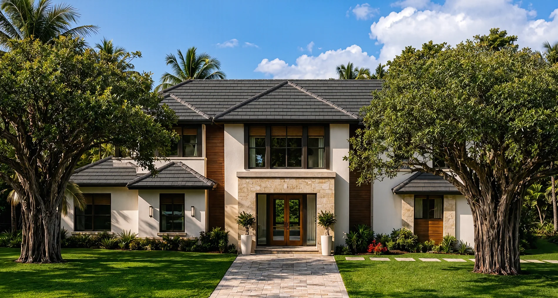 Front elevation framed by mature trees