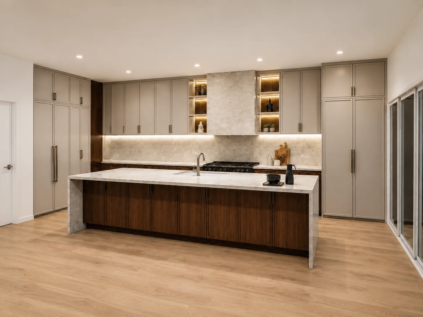 Walnut cabinetry with Sub-Zero and Wolf appliances and lit glass display